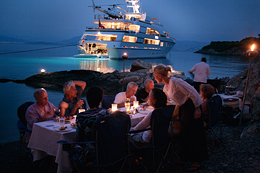distinguished guests dining in style on the beach